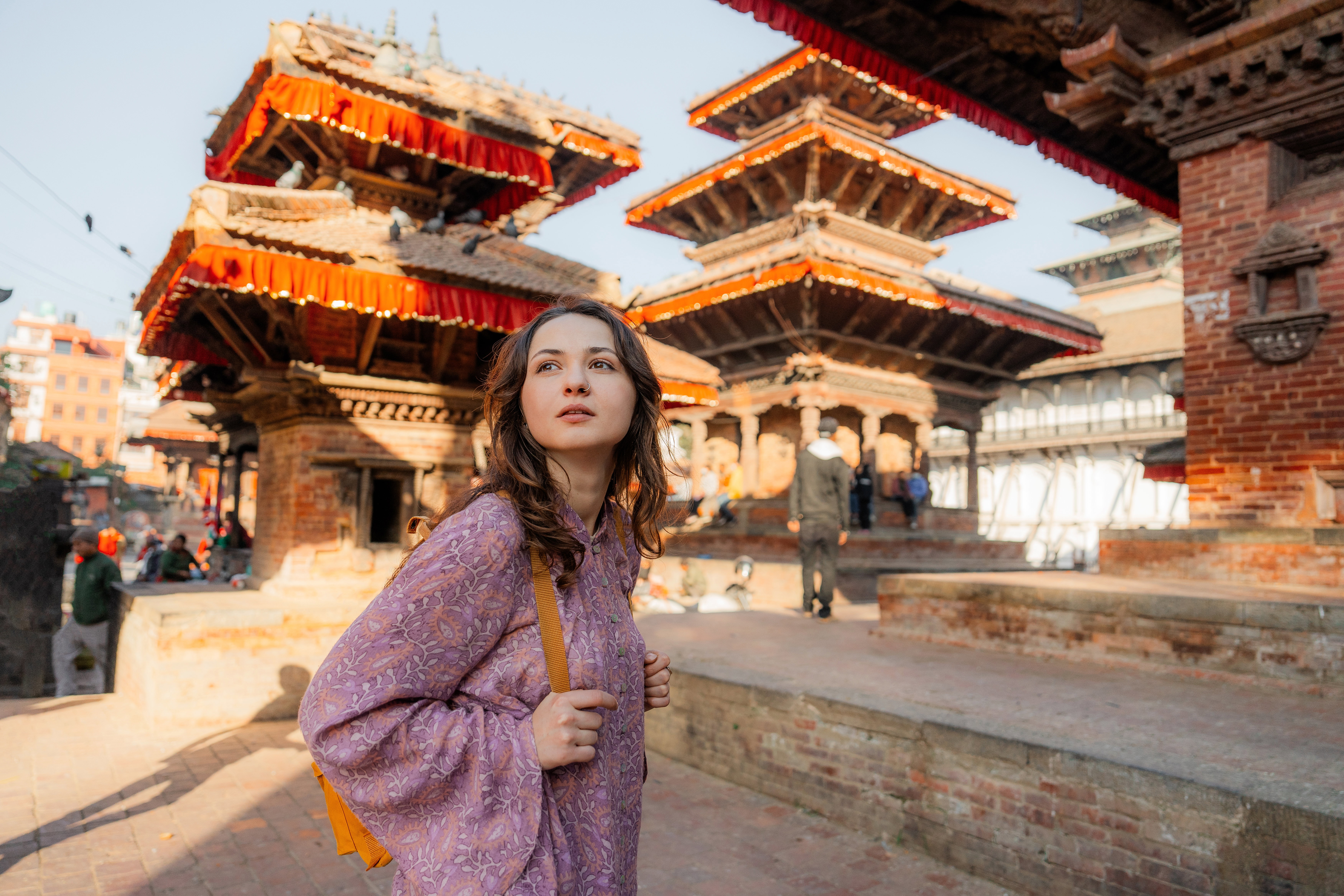 Young Caucasian woman exploring in Bhaktapur Durbar square in Kathmandu