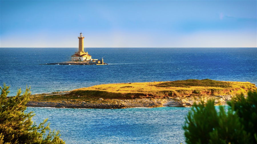 Lighthouse in the sea in Kamenjak National Park in Premantura, Croatia