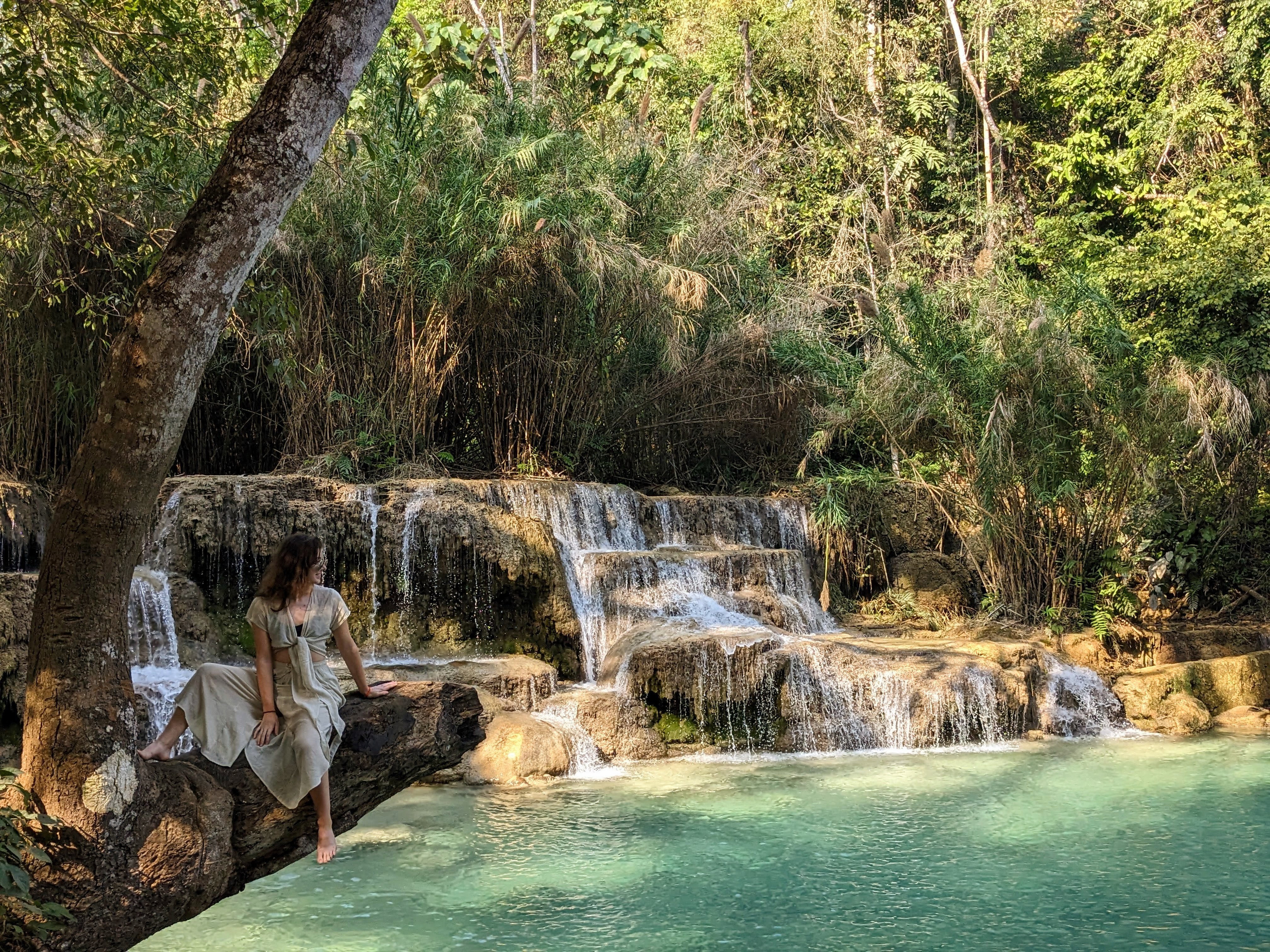 Tilly stood by a waterfall in Laos, Asia