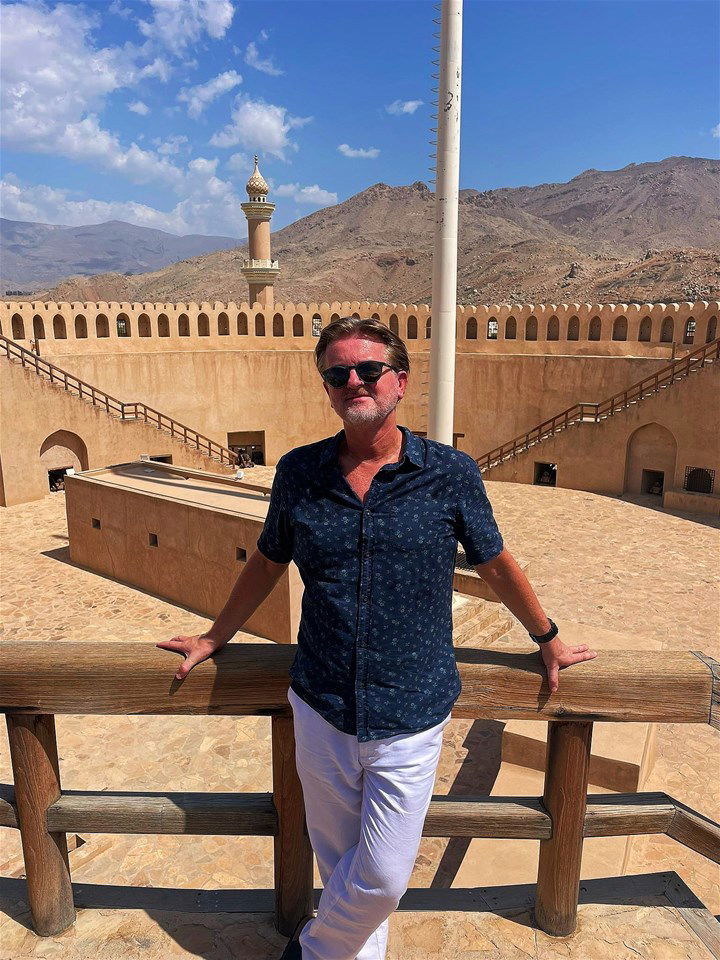 Jamie in front of a mosque in Oman