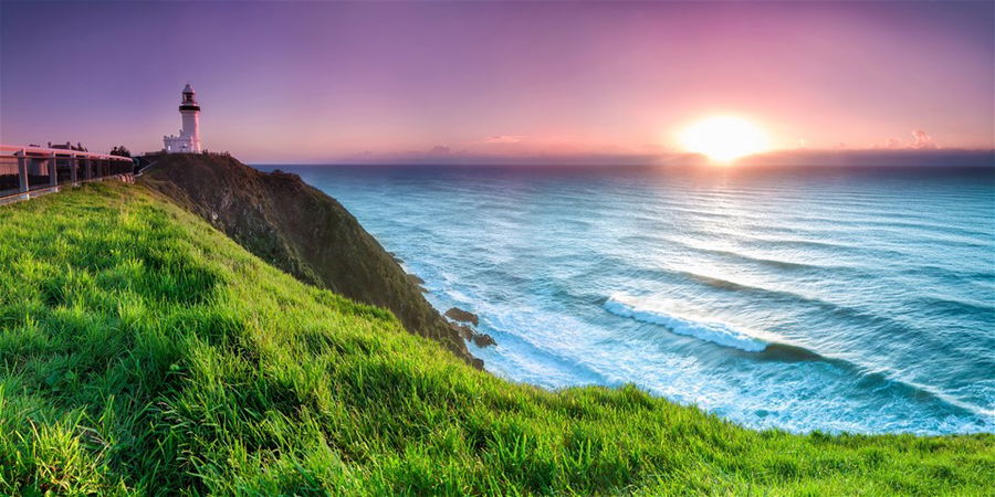 Sunset viewed from a clifftop, looking down on the beautiful beach below