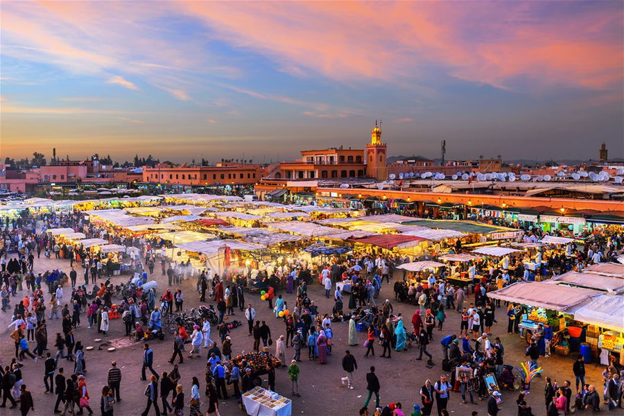 Evening Djemaa El Fna Square with Koutoubia Mosque, Marrakech, Morocco