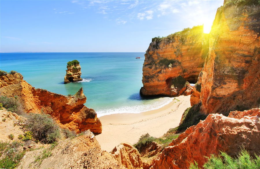 Rocky beach at sunset, Lagos, Portugal