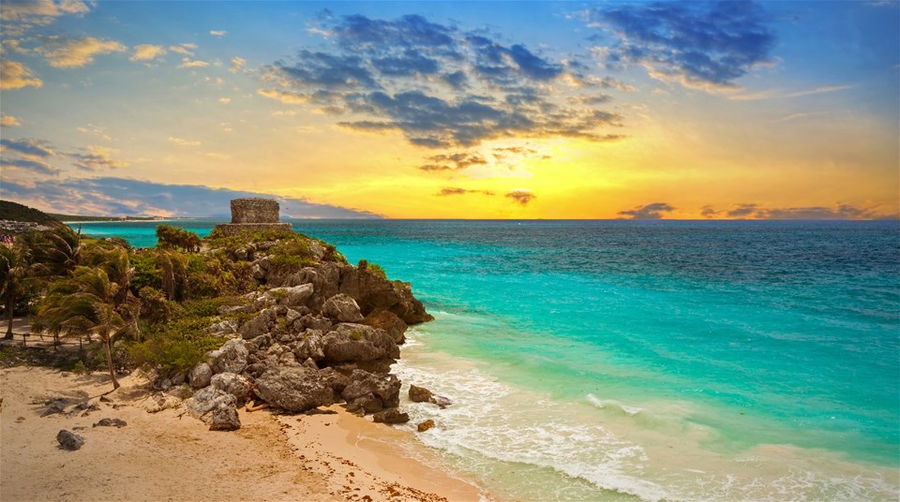 Caribbean beach at the cliff in Tulum at sunset