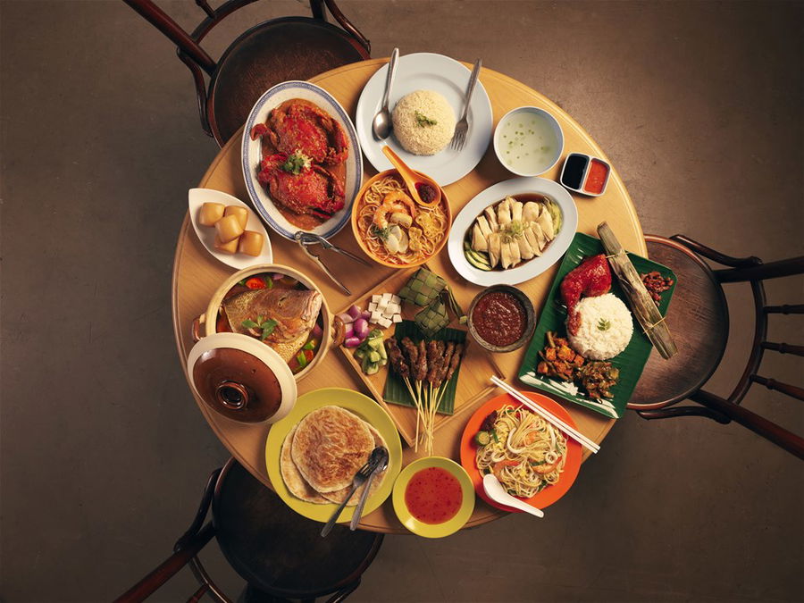 A large selection of local delicacies at a hawker market in Singapore