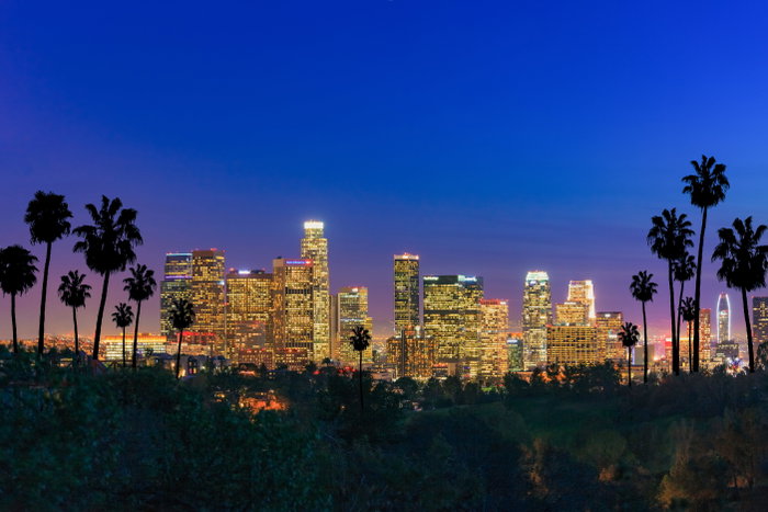 Skyscrapers of Los Angeles skyline at sunset with city lights. Urban sprawl with muti colored lights fill the foreground and palm trees are on both sides while deep blue color fills the sky. CA Los Angeles County City Of Los Angeles Urban Skyline Downtown District Summer Blue 2015 Architecture Building Exterior Built Structure California City City Life Cityscape Color Image Copy Space Day Dusk Financial District Horizontal No People Office Building Exterior Outdoors Photography Scenics - Nature Sky Skyscraper Southern California Street Light Tall - High Tower Travel Destinations USA Urban Sprawl Western USA