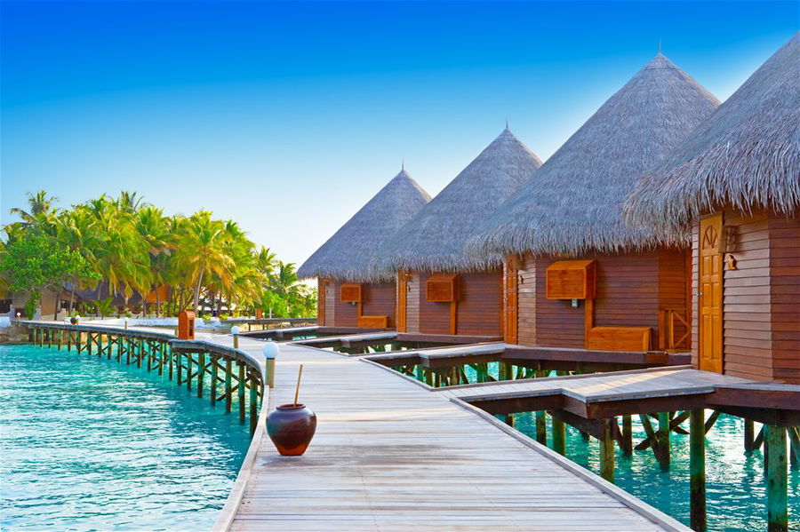 A row of overwater bungalows in the Maldives