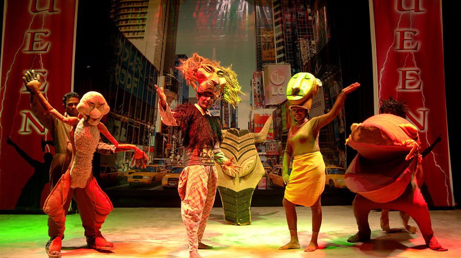 Dancers in traditional dress perform on stage in Sri Lanka