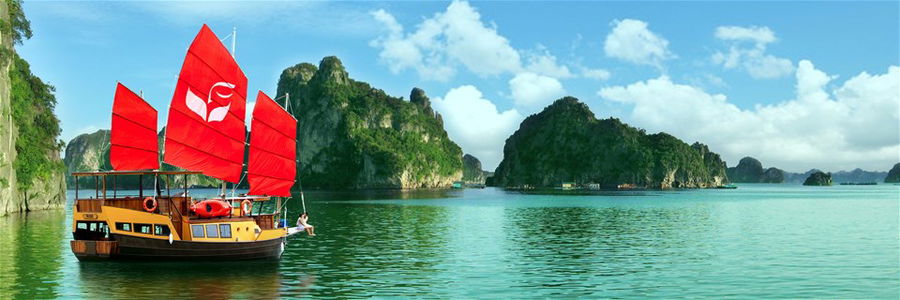 A boat with red sails on Halong Bay in Vietnam