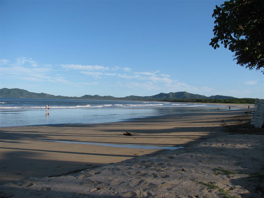 A deserted beach in Tamarindo Costa Rica on a sunny day