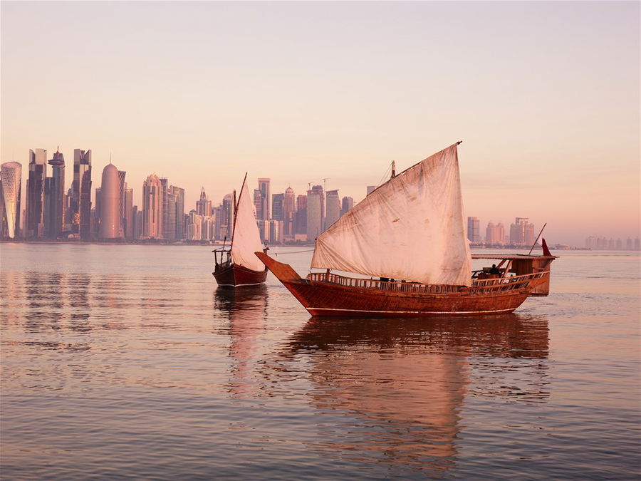 Dhow boat on river and Qatar Skyline